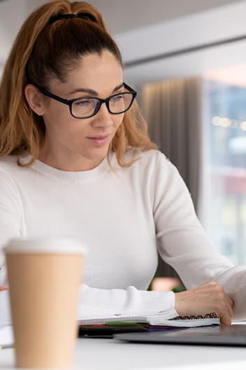 a woman with folders in her hand